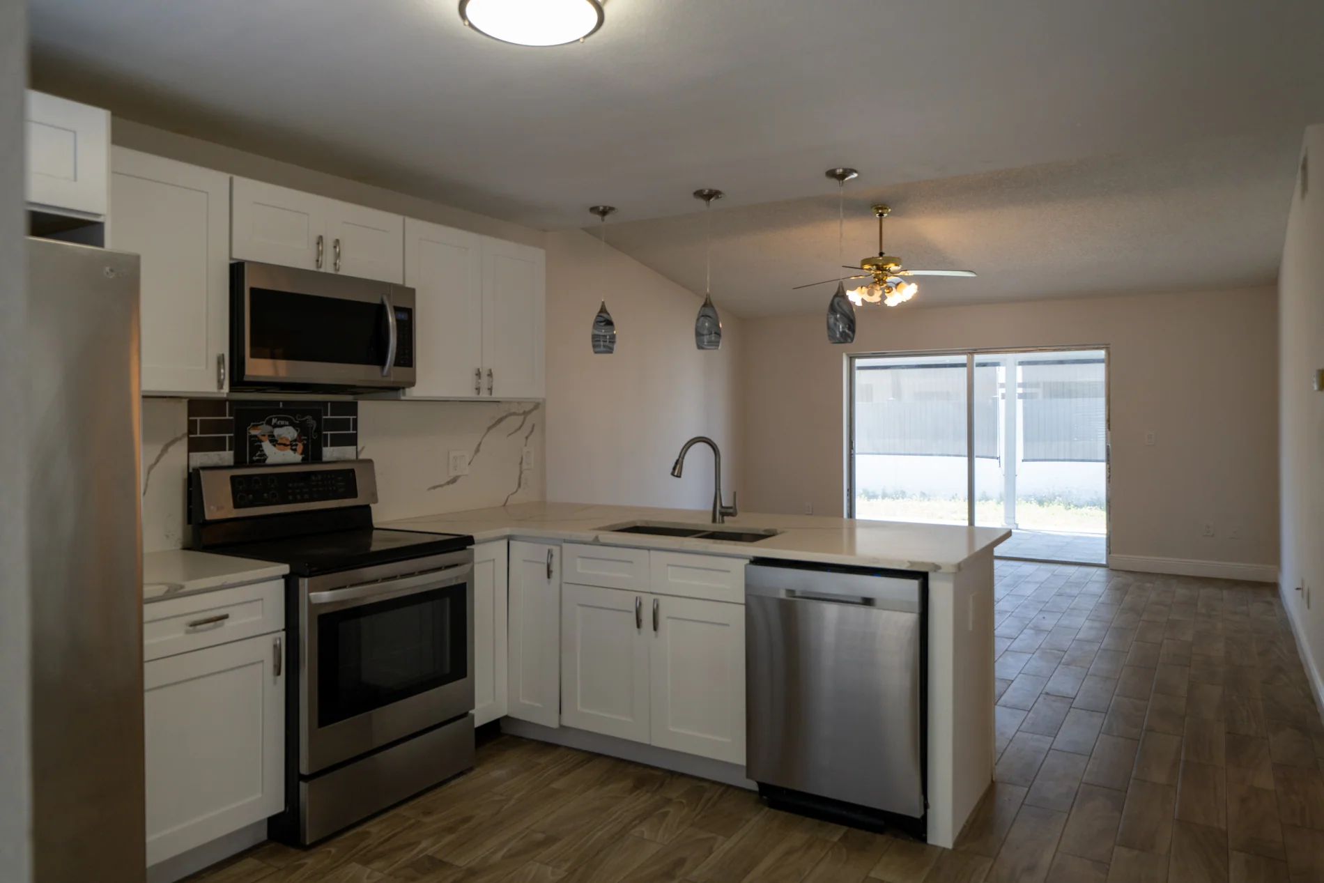 Bright residential kitchen opening toward the patio