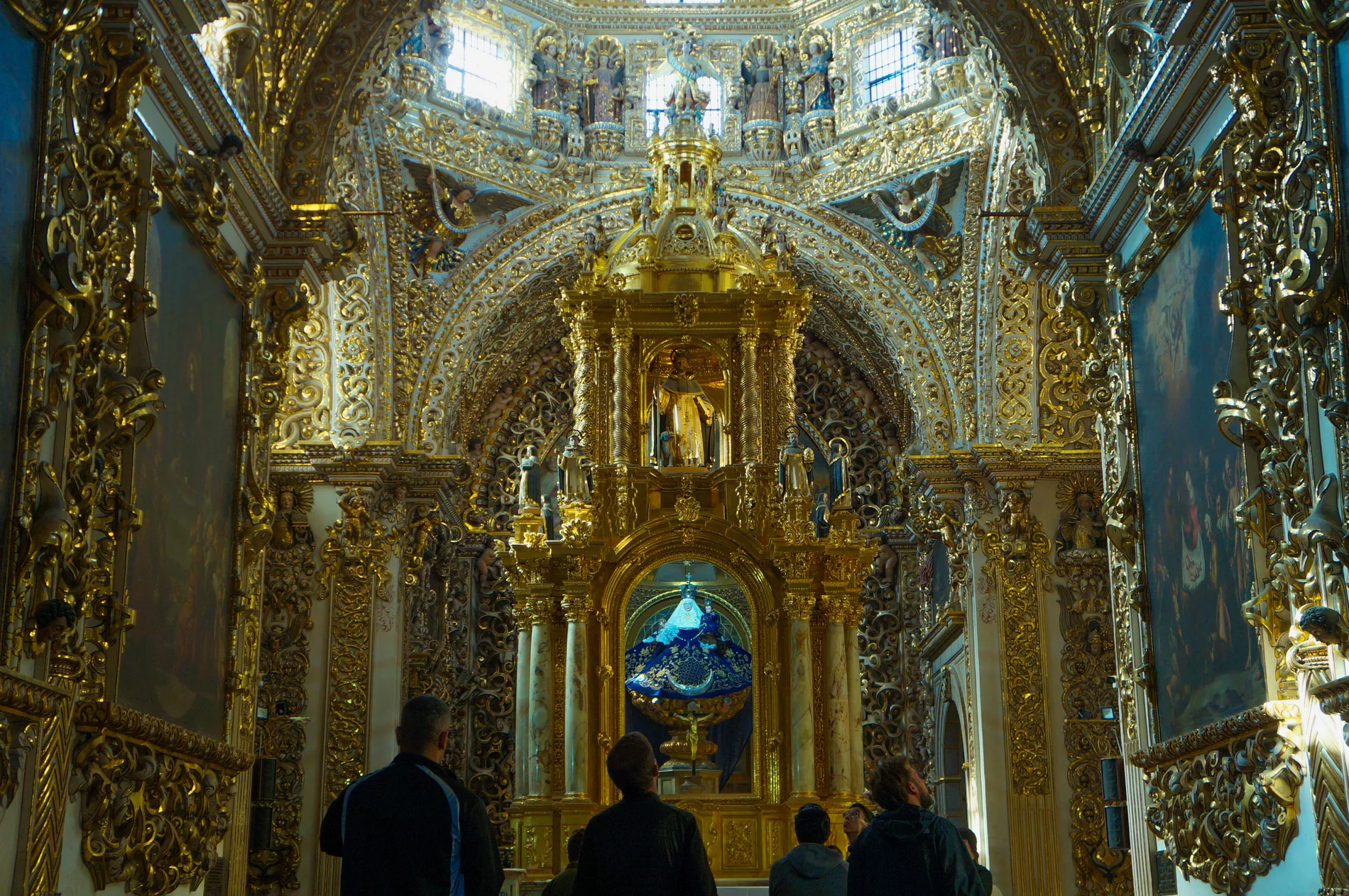 Elaborate gold church interior filled with detail