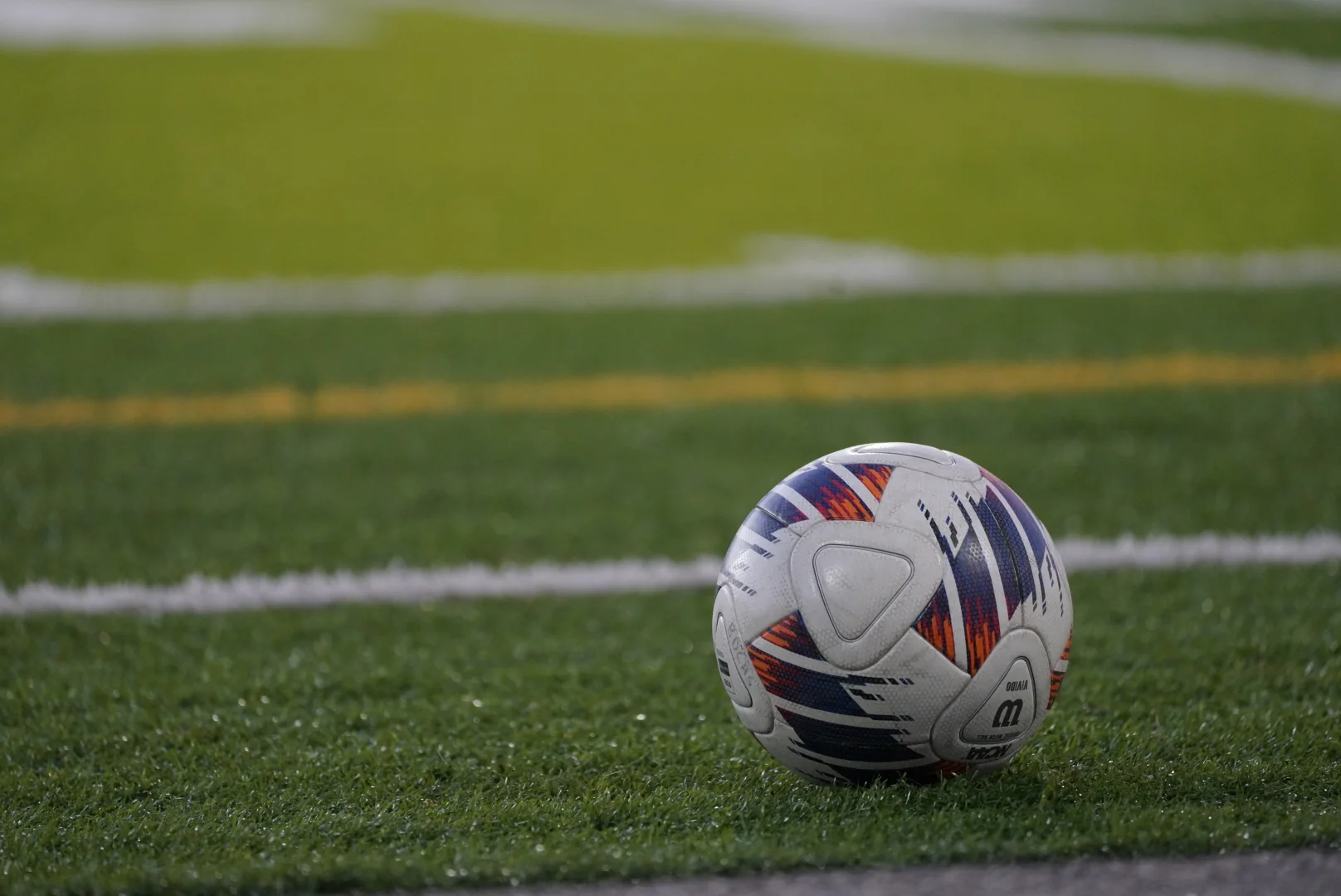 Soccer ball resting near the sideline